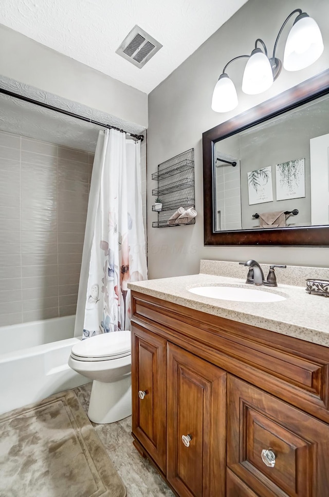 full bathroom featuring shower / tub combo, vanity, and toilet