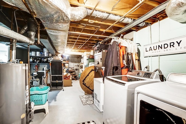 basement featuring water heater and washer and dryer