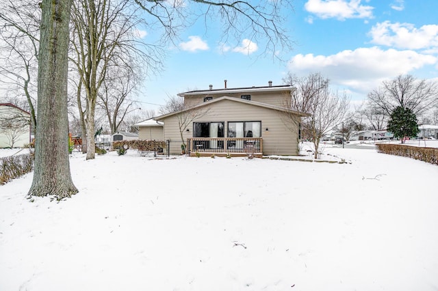 view of snow covered house