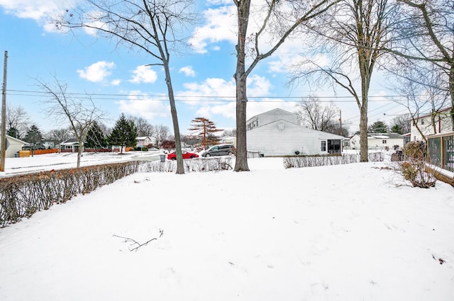 view of yard layered in snow