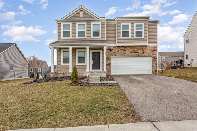 view of front facade with a garage, stone siding, aphalt driveway, and a front yard