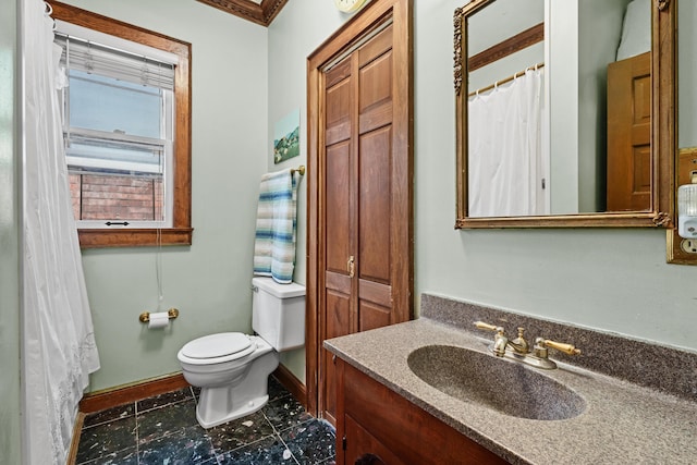 bathroom featuring vanity and toilet