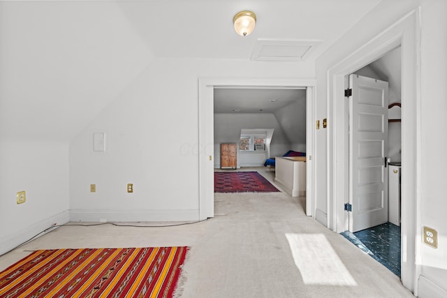 interior space featuring carpet and lofted ceiling