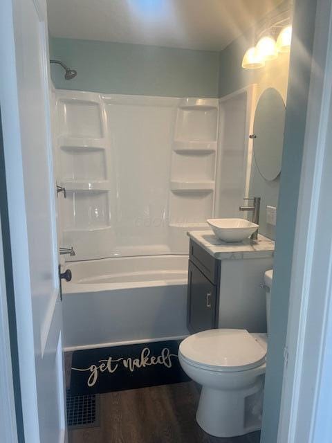 full bathroom with vanity, shower / bathing tub combination, wood-type flooring, and toilet