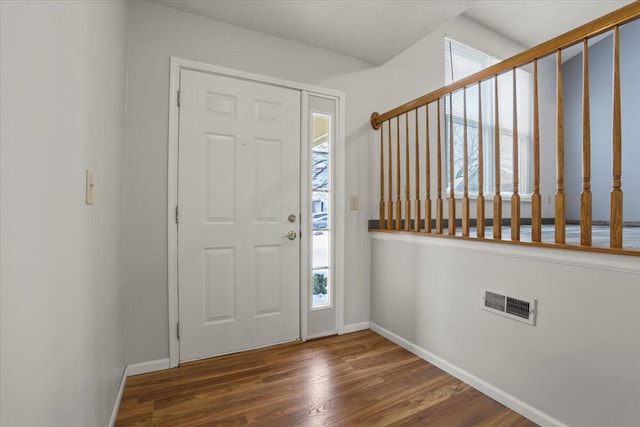 entrance foyer featuring dark hardwood / wood-style floors