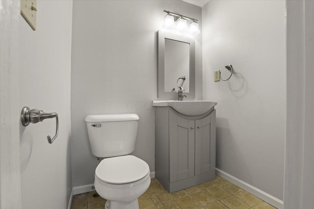 bathroom with toilet and vanity