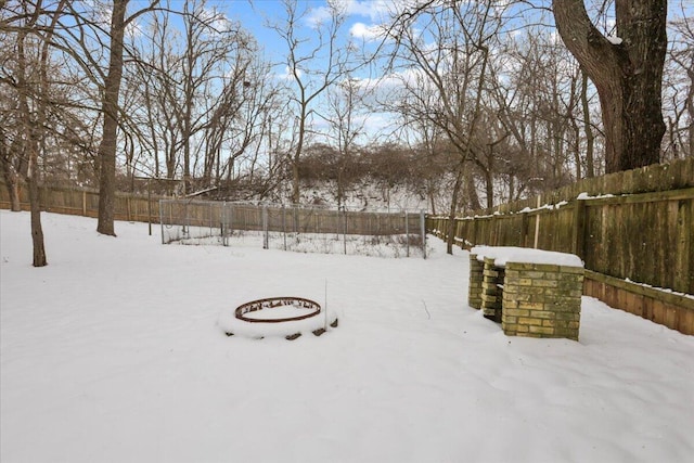 view of yard covered in snow