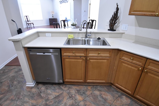 kitchen with dishwasher, kitchen peninsula, and sink