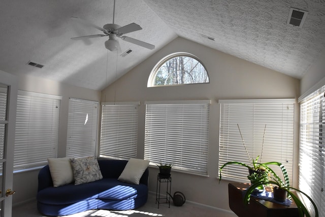 sunroom with a wealth of natural light, lofted ceiling, and ceiling fan