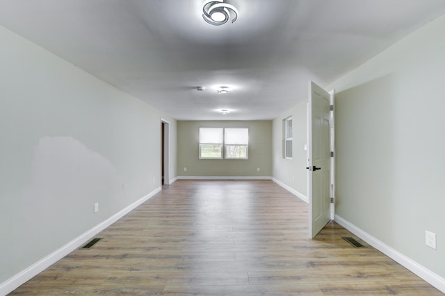 unfurnished room featuring light hardwood / wood-style flooring