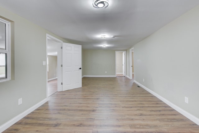 spare room featuring light hardwood / wood-style floors