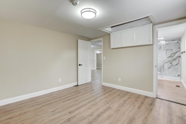 spare room with light hardwood / wood-style floors