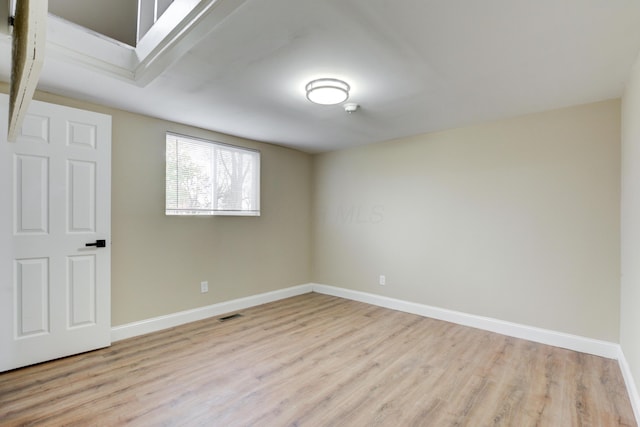 spare room featuring light wood-type flooring