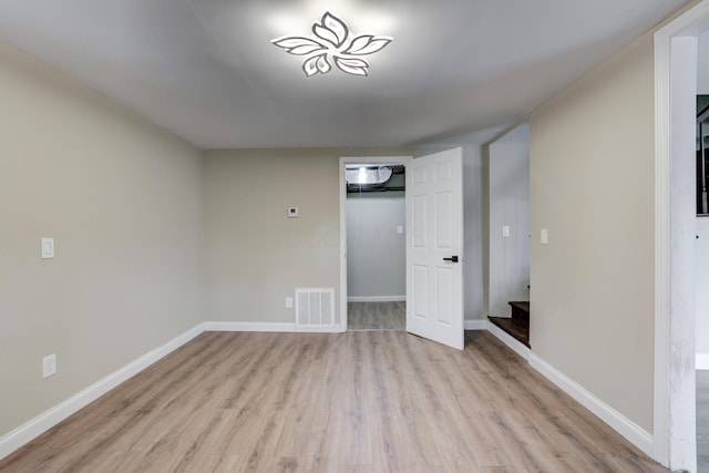 unfurnished bedroom featuring light wood-type flooring