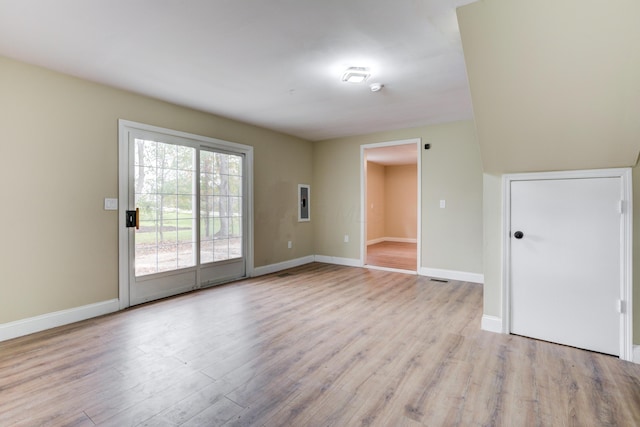 spare room featuring light wood-type flooring