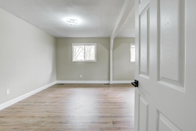 unfurnished room with light hardwood / wood-style flooring