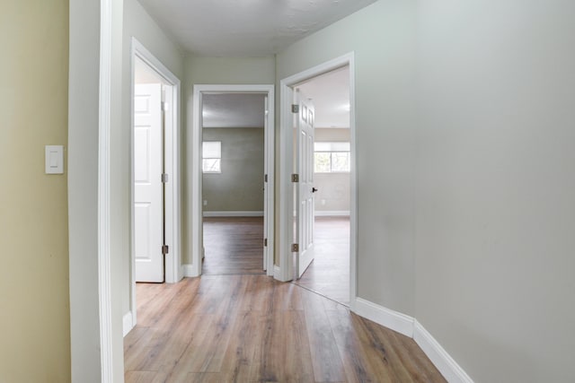 hall with light wood-type flooring