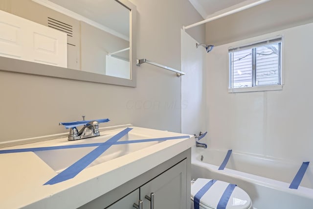 2573 Howey Rd, Columbus, OH 43211 - full bathroom featuring vanity, ornamental molding, toilet, and washtub / shower combination