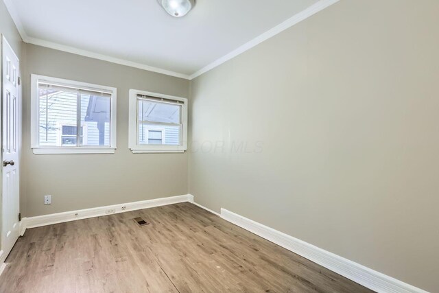 2573 Howey Rd, Columbus, OH 43211 - unfurnished room with ornamental molding and light hardwood / wood-style floors