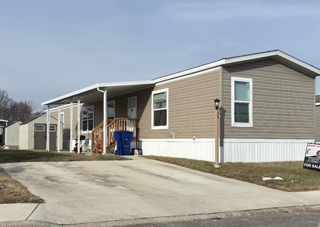 view of front facade with a storage shed