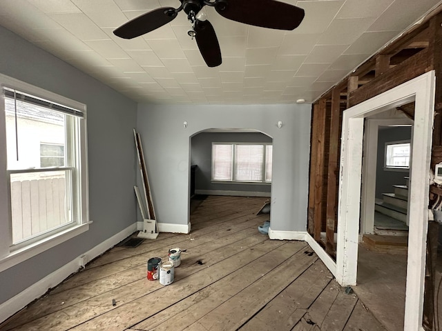 unfurnished room featuring ceiling fan and wood-type flooring