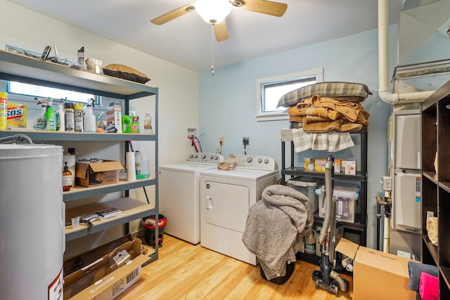 clothes washing area with ceiling fan, light wood-type flooring, and separate washer and dryer