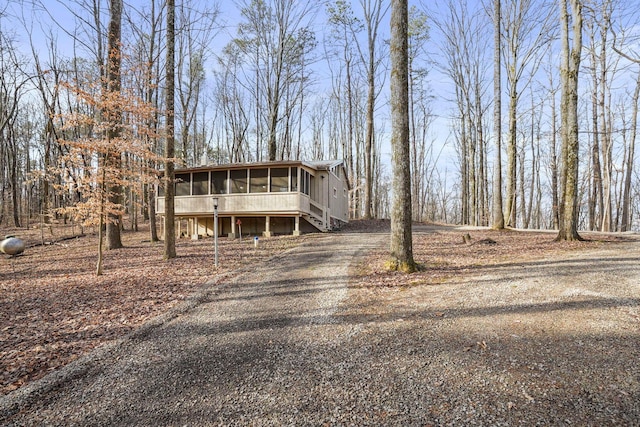 view of front of home featuring a sunroom