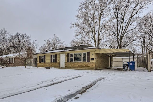 single story home featuring a carport