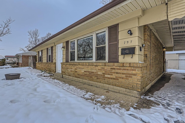 view of snow covered property