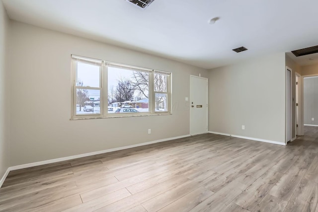 unfurnished room with light hardwood / wood-style flooring