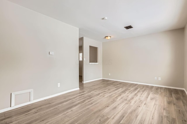 empty room featuring light hardwood / wood-style floors