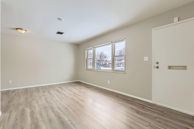 empty room with light wood-type flooring