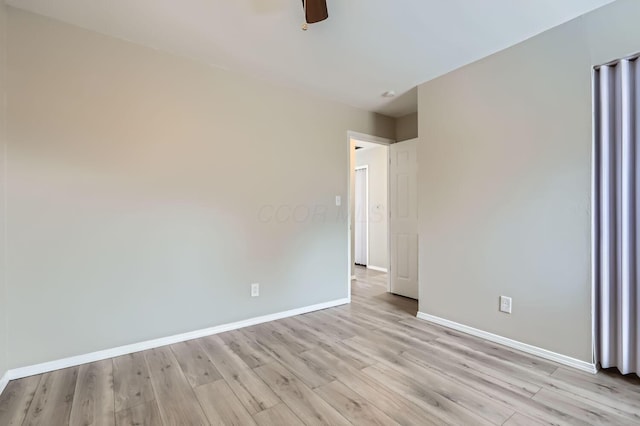 empty room featuring ceiling fan and light hardwood / wood-style floors