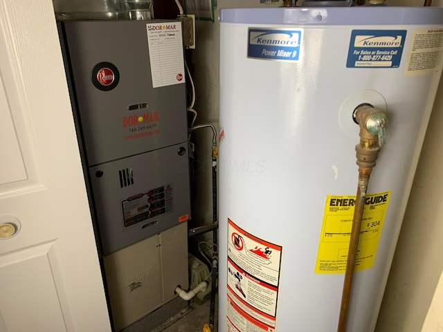 utilities featuring water heater and heating unit