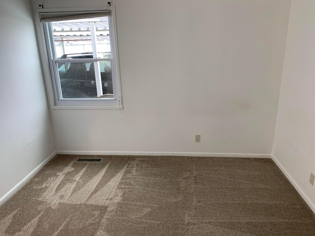 unfurnished room with carpet flooring