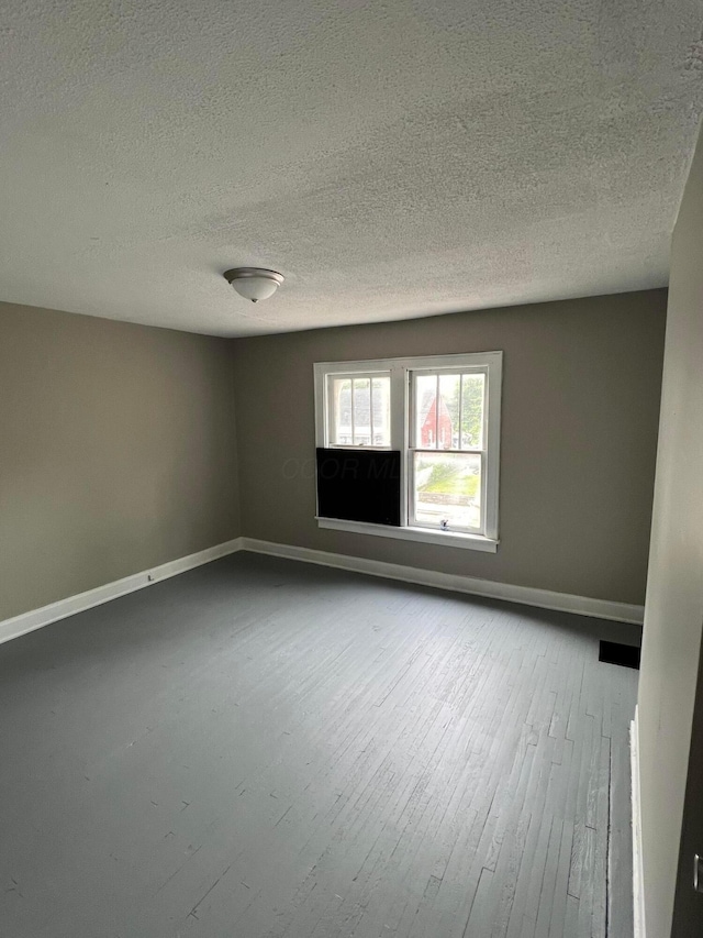 spare room featuring a textured ceiling