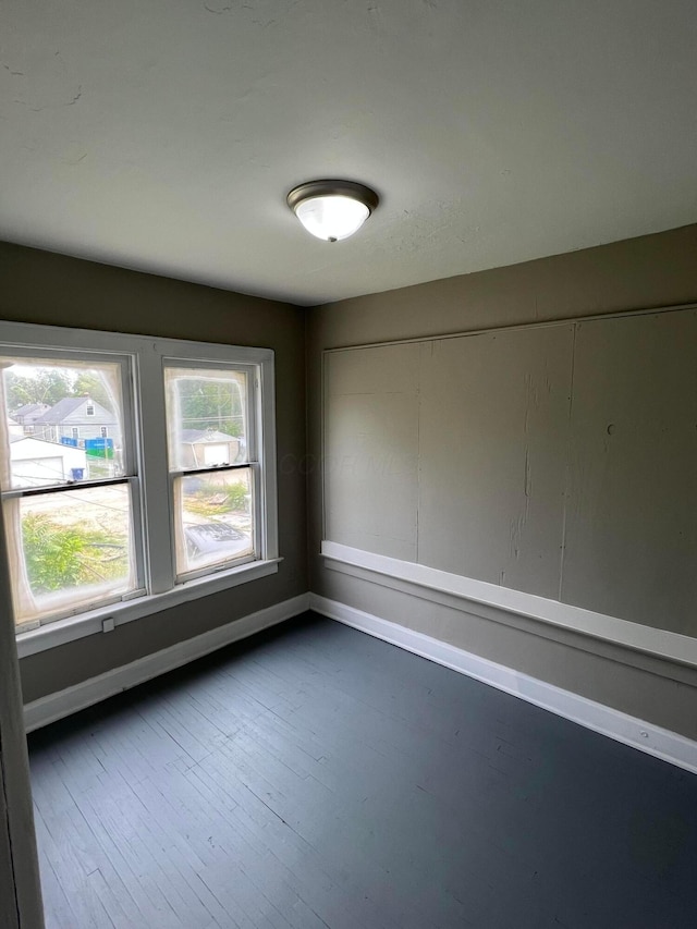 empty room featuring dark wood-type flooring