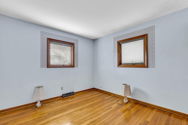 unfurnished room featuring light wood-type flooring