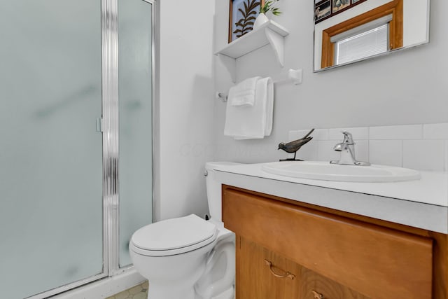 bathroom with vanity, toilet, and walk in shower