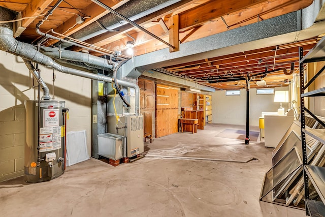 basement with washer / clothes dryer, gas water heater, and heating unit