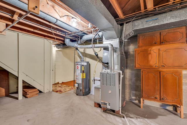 basement featuring gas water heater and heating unit