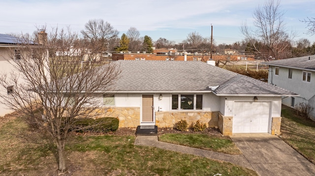 view of front of property with a garage and a front lawn