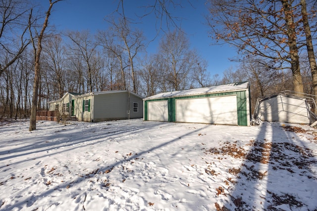 view of snow covered garage