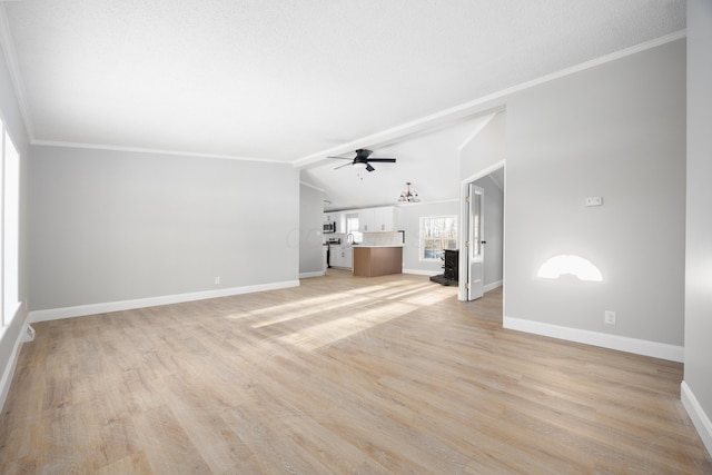 unfurnished living room with ceiling fan, crown molding, lofted ceiling, and light wood-type flooring