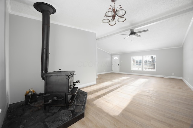 living room featuring ceiling fan with notable chandelier, light hardwood / wood-style floors, and crown molding