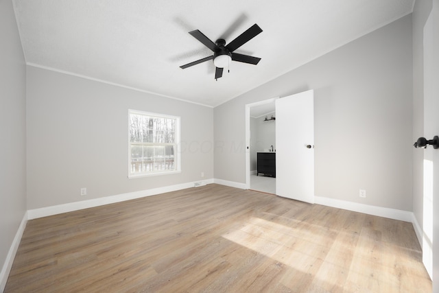 unfurnished bedroom featuring ceiling fan, light wood-type flooring, and lofted ceiling