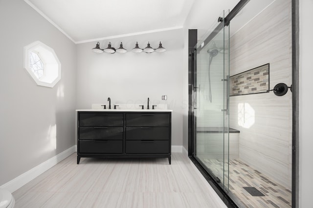 bathroom featuring vanity, crown molding, and a shower with shower door