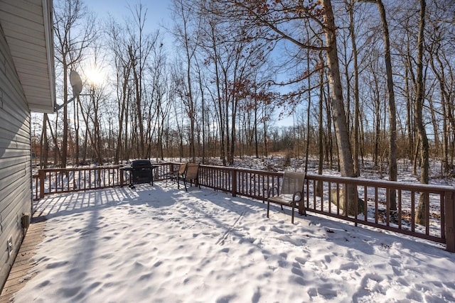 snow covered deck featuring grilling area