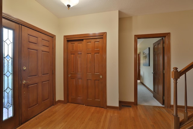 entryway with light hardwood / wood-style flooring