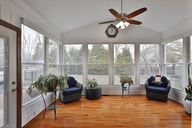 sunroom featuring vaulted ceiling and ceiling fan